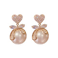 Pearl Bow Drop Earrings, close-up